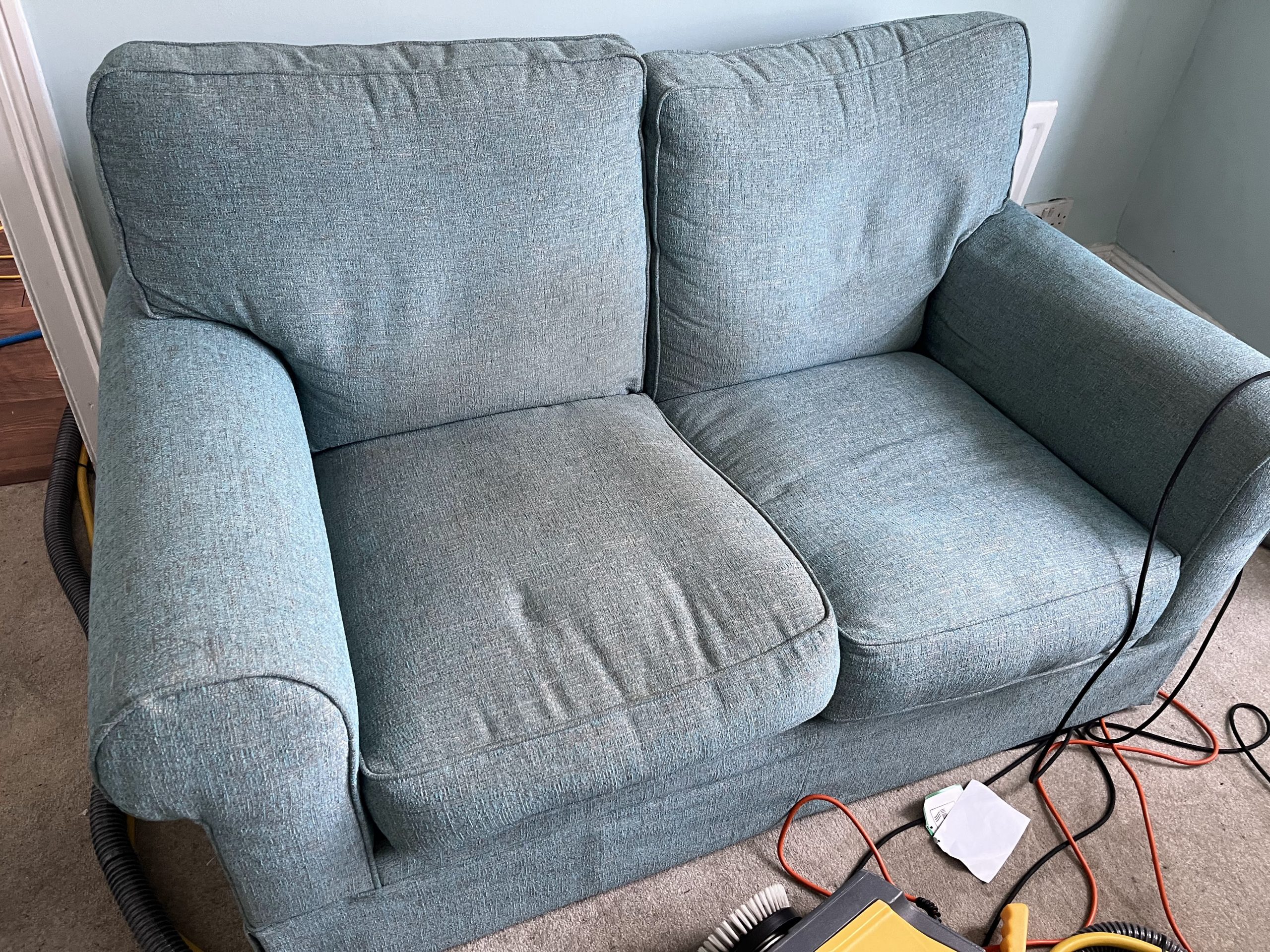 How does upholstery cleaning improve indoor air quality?
